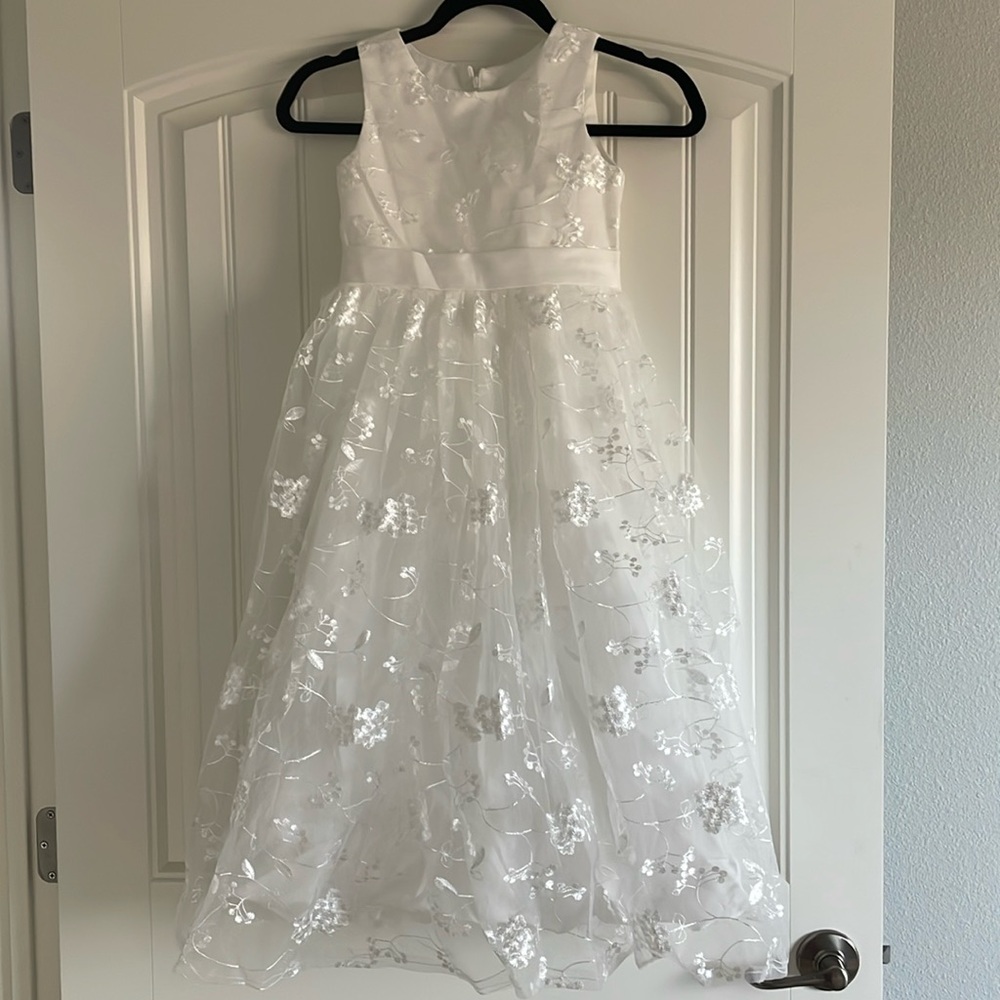 A beautiful Ivory lace dress for a young girl